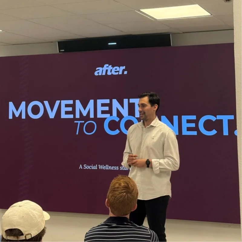 Arturo Serrano, founder of After, presenting After to a group, with the slogan “Movement to connect” on screen